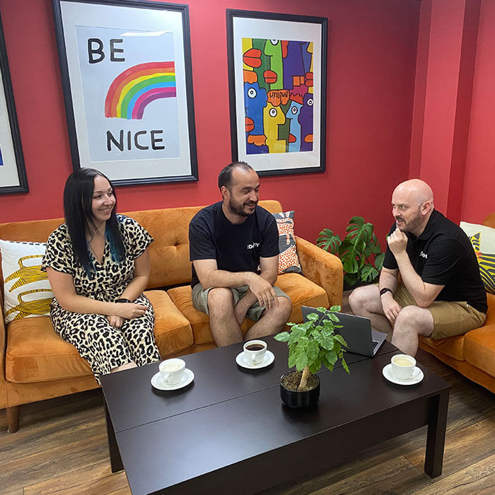 Deploy team collaborating in modern office workspace